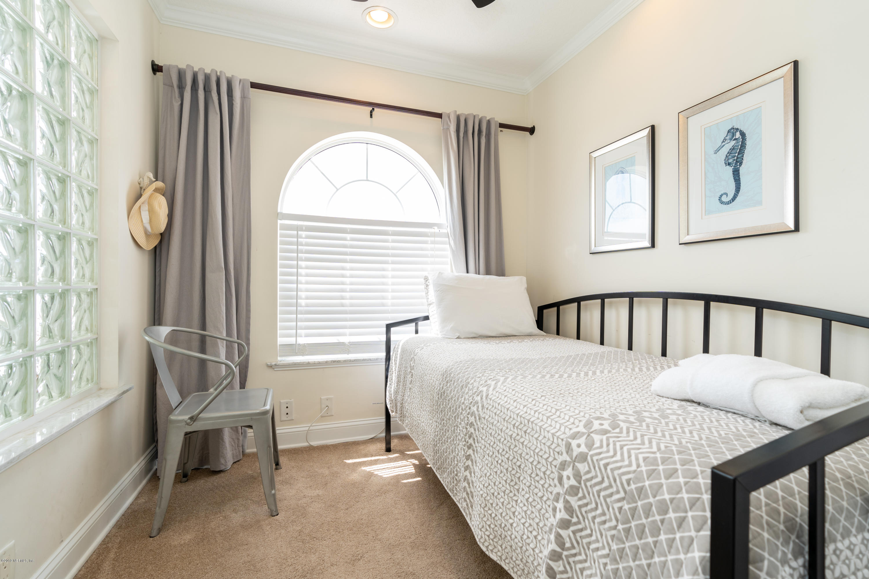 4 3rd Street St. Augustine, FL 32080 - Photo 25 of 47 a bedroom with a bed and a window