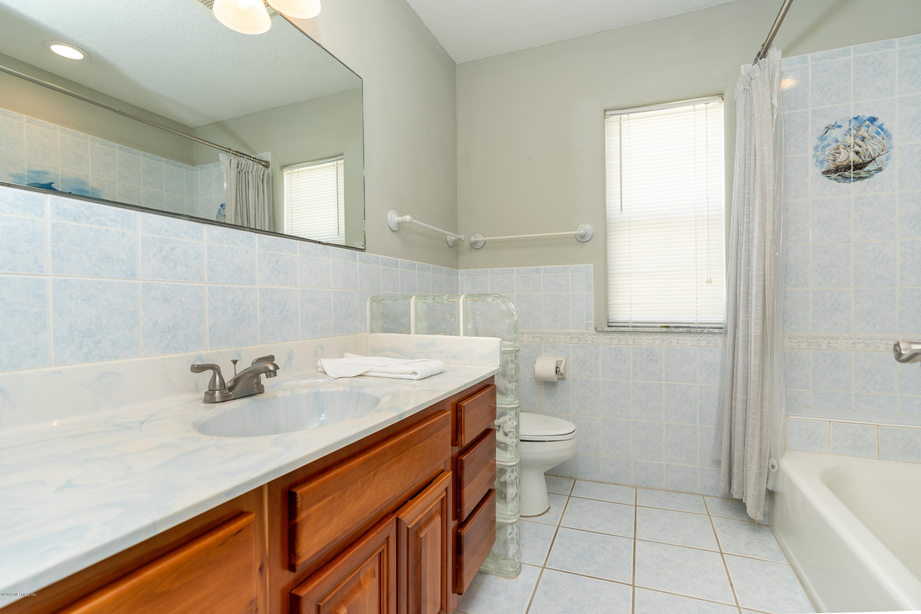 4 3rd Street St. Augustine, FL 32080 - Photo 26 of 47 a bathroom with a sink a toilet and bathtub
