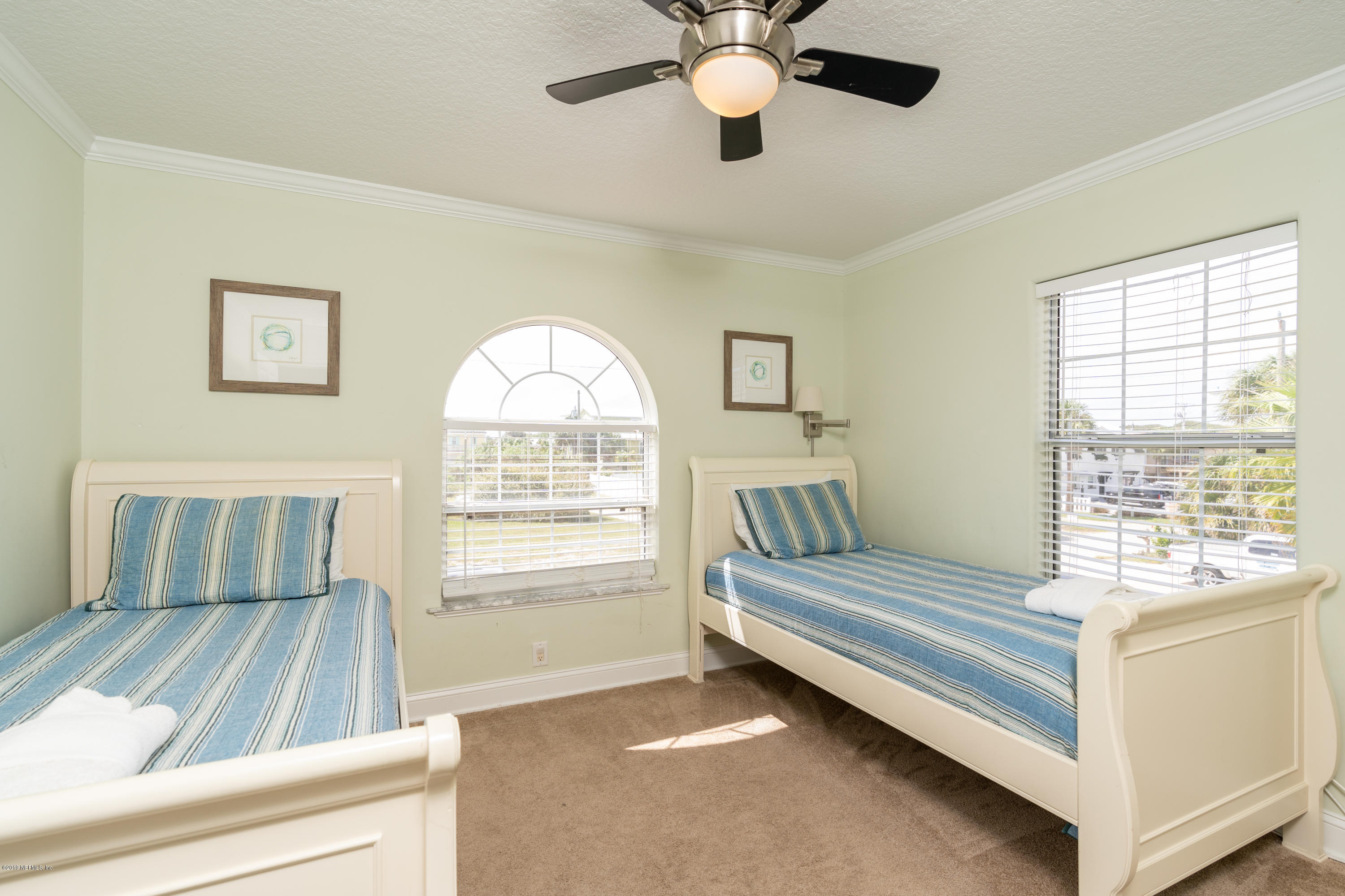 4 3rd Street St. Augustine, FL 32080 - Photo 27 of 47 a bedroom with a bed and a large window