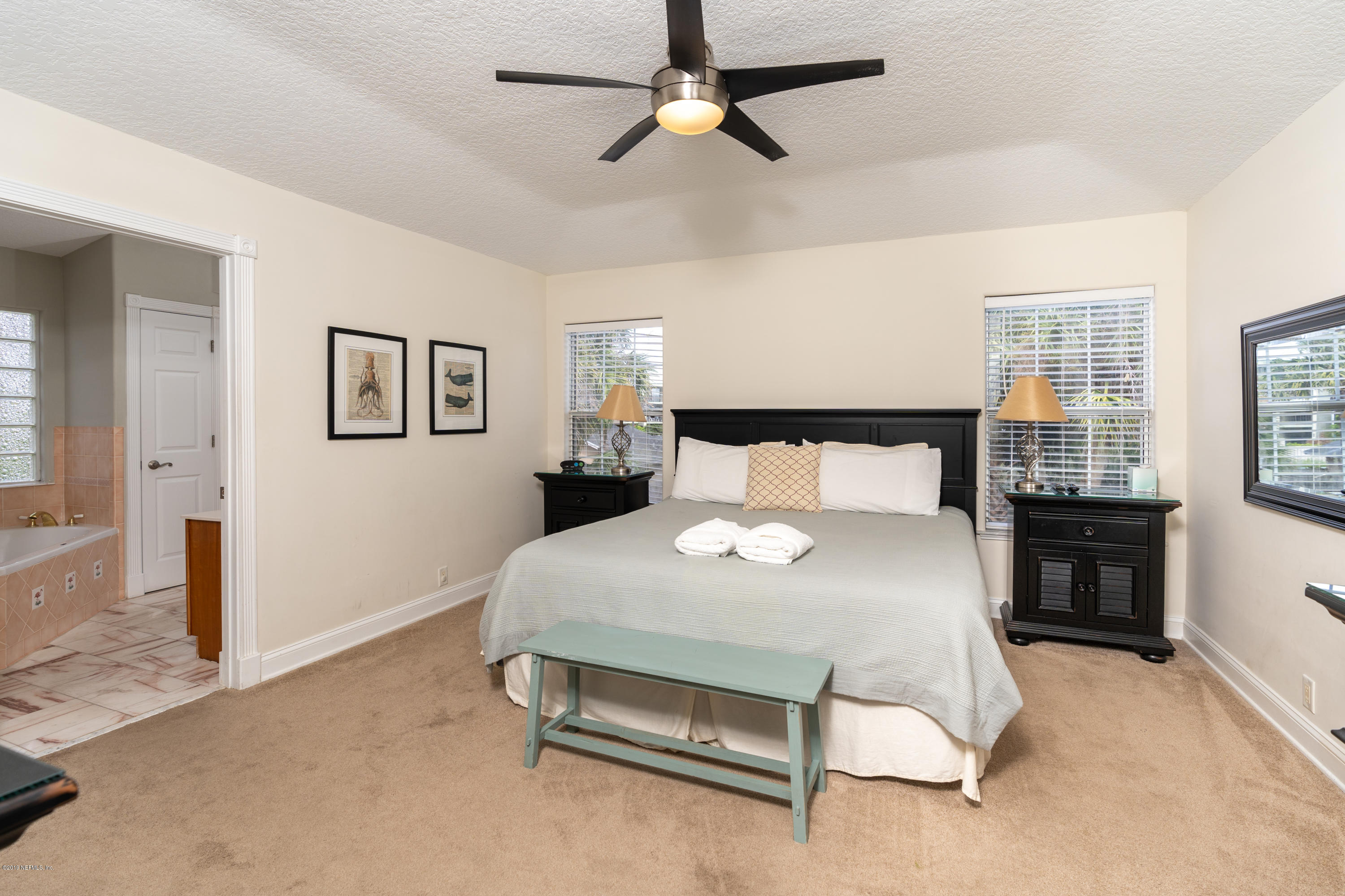 4 3rd Street St. Augustine, FL 32080 - Photo 29 of 47 a bedroom with a bed and window