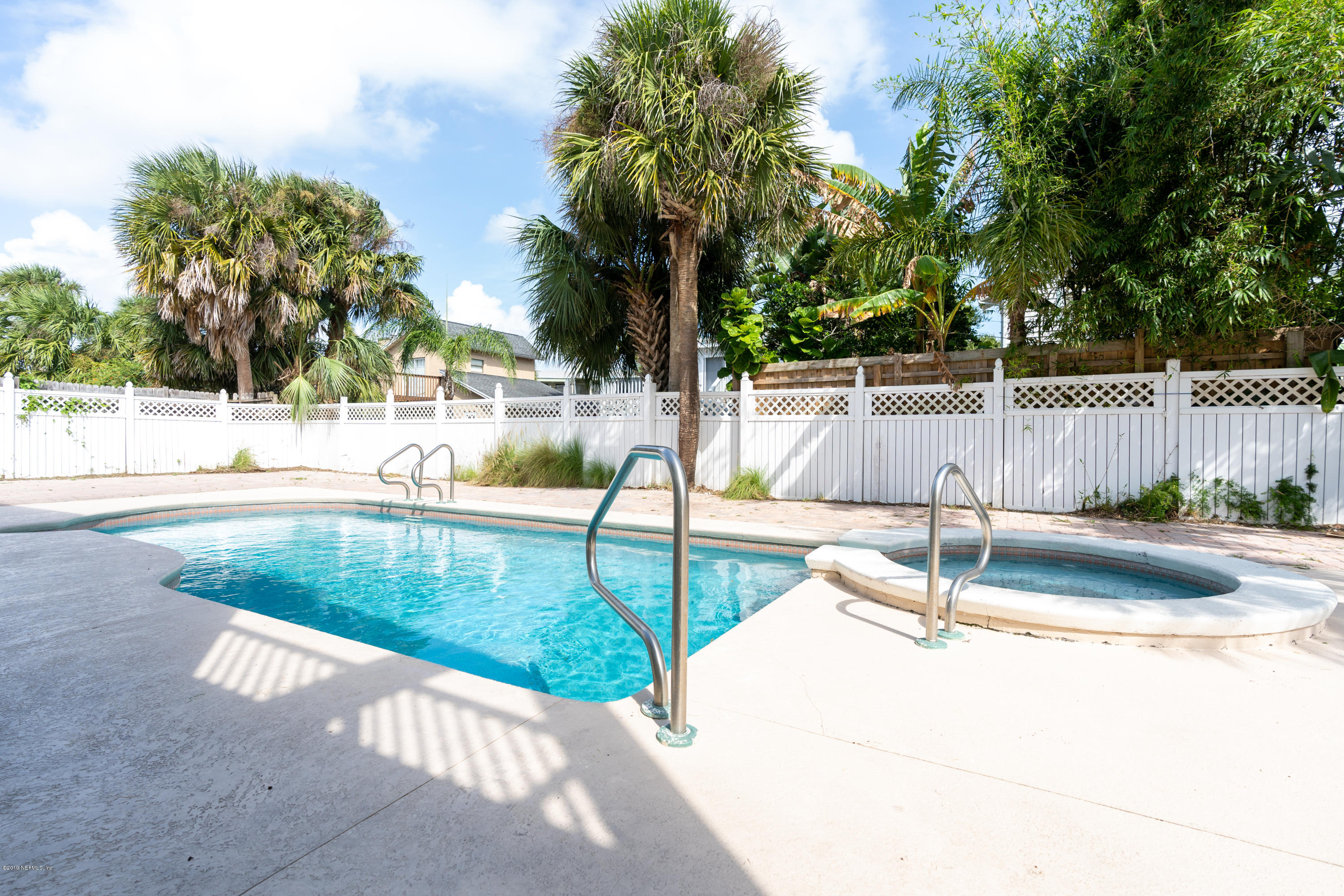4 3rd Street St. Augustine, FL 32080 - Photo 3 of 47 a view of a swimming pool with a patio