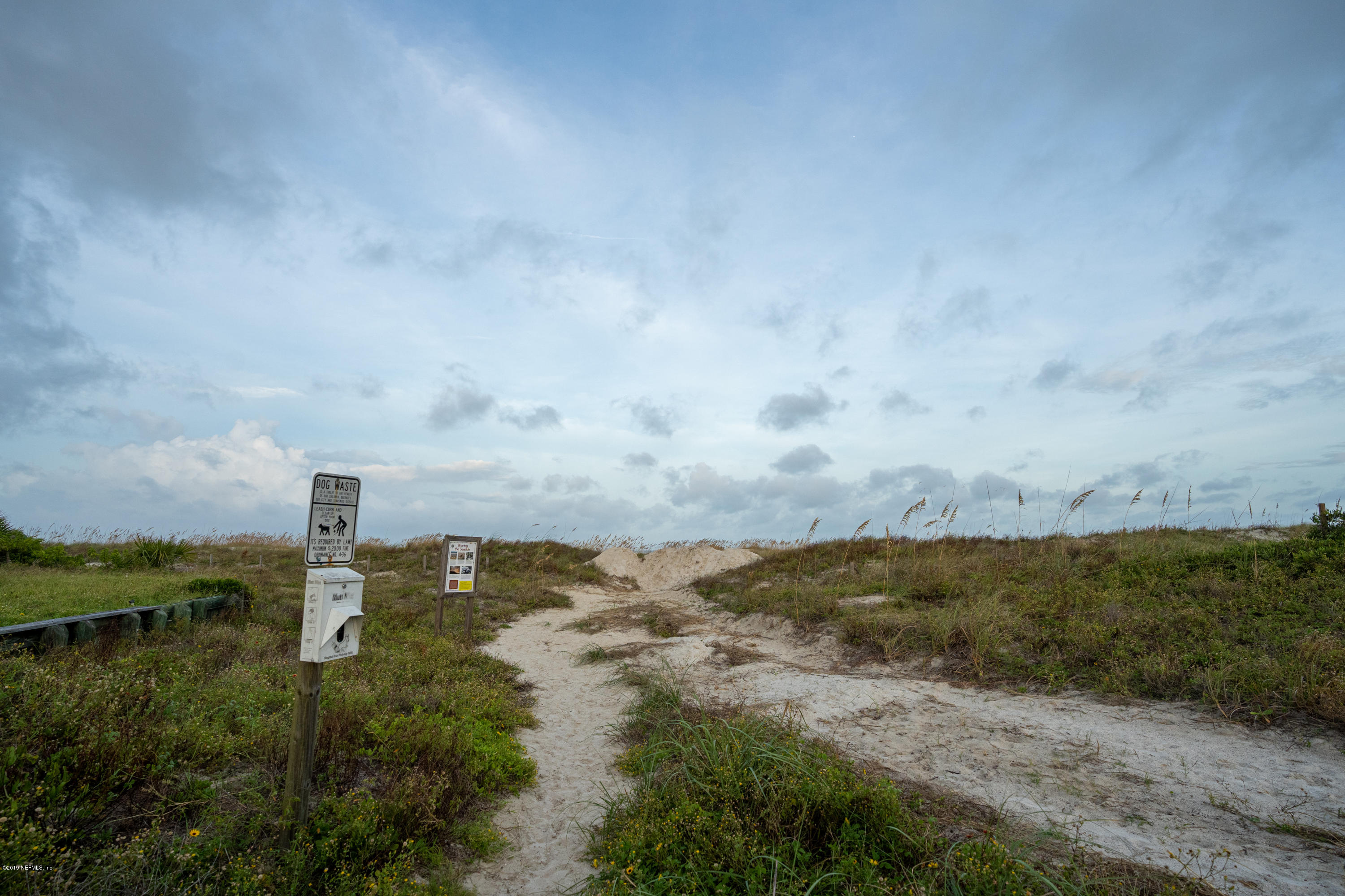 4 3rd Street St. Augustine, FL 32080 - Photo 43 of 47 a view of a lake with a building in the background