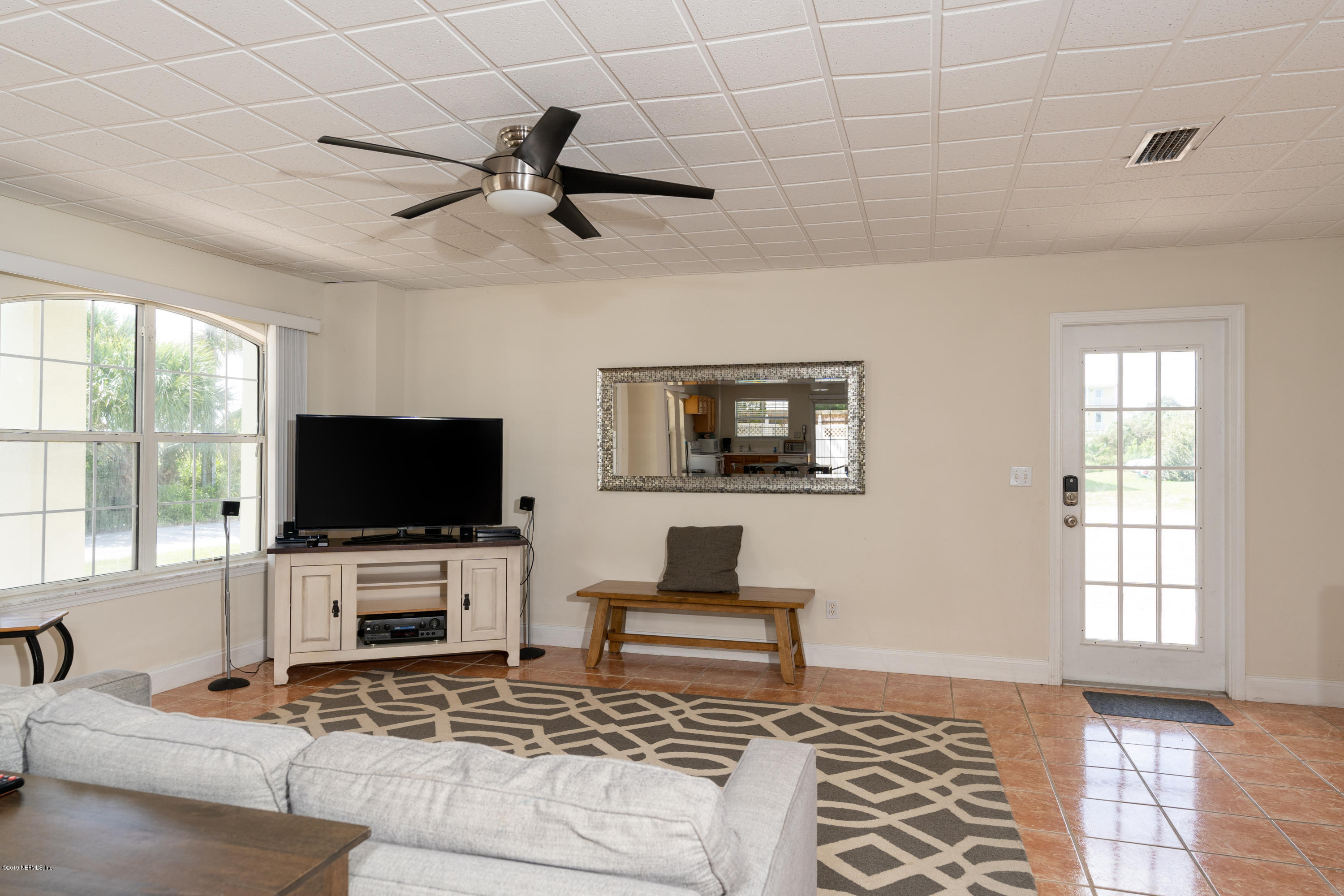 4 3rd Street St. Augustine, FL 32080 - Photo 7 of 47 a living room with furniture and a flat screen tv