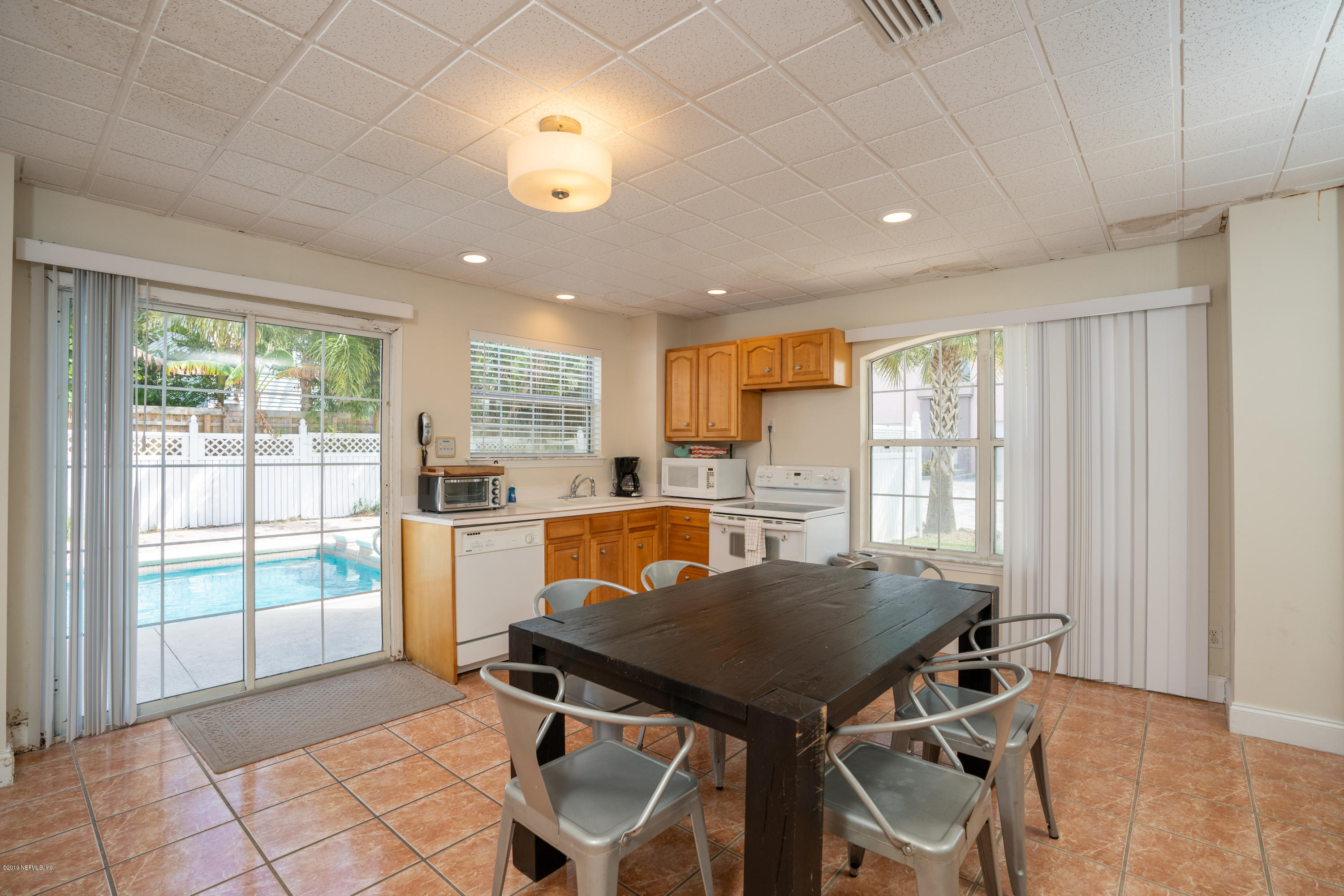 4 3rd Street St. Augustine, FL 32080 - Photo 10 of 47 a view of a dining room with furniture and window