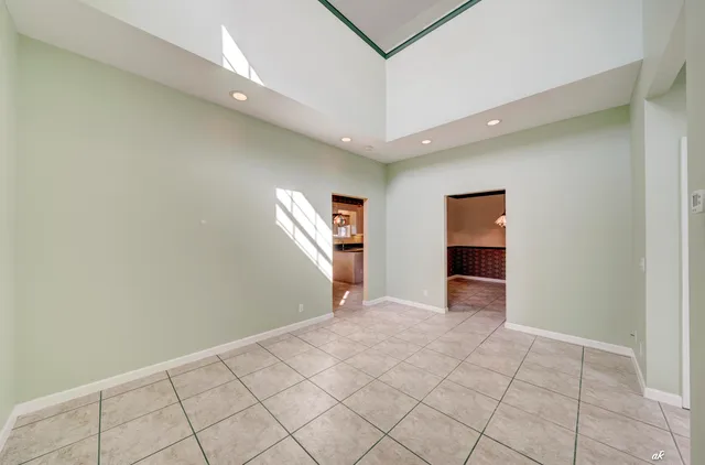 a bathroom with a granite countertop sink toilet a mirror and shower