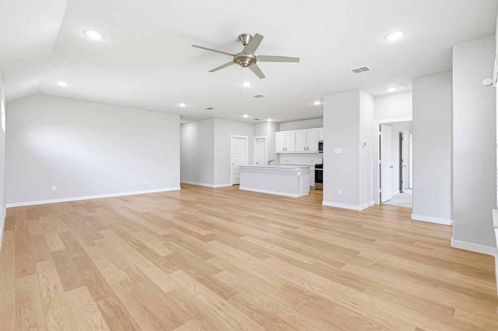2108 Mossfield Lane Forney, TX 75126 - Photo 7 of 28 Open-concept living space featuring wood-finish flooring, recessed lighting, and a ceiling fan