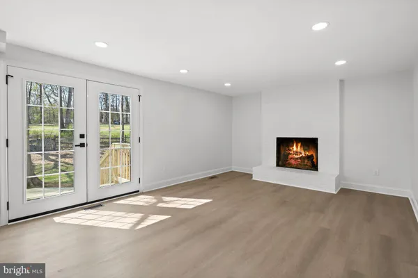 an empty room with windows and closet