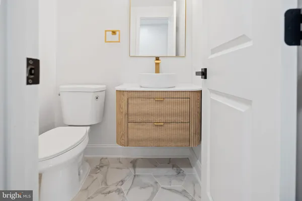 a bathroom with a toilet and a sink