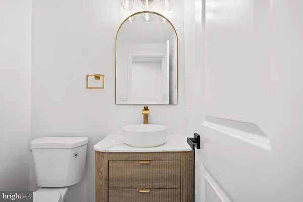 a bathroom with a toilet sink and shower