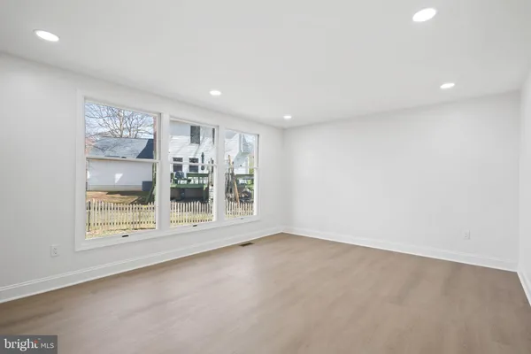 a large kitchen with stainless steel appliances kitchen island granite countertop a sink a stove and a granite counter tops