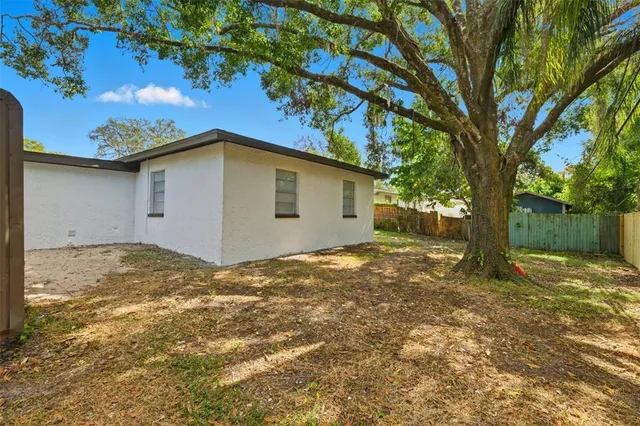 a view of a yard with a tree