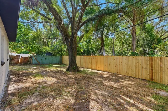 a couple of potted plants sitting in front of a building