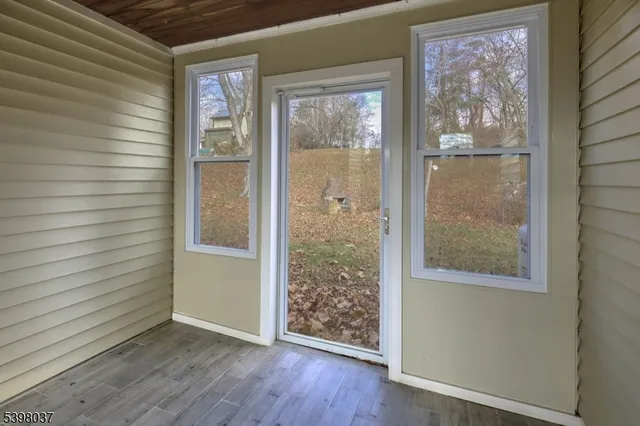 a view of a room that has a large window