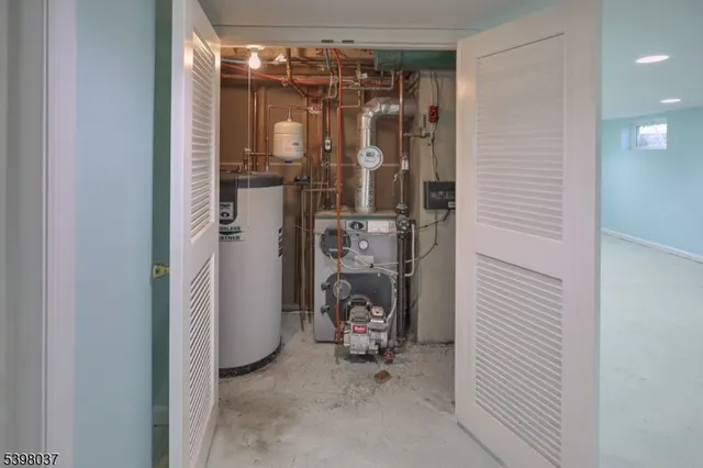 a view of a livingroom with furniture and floor to ceiling window