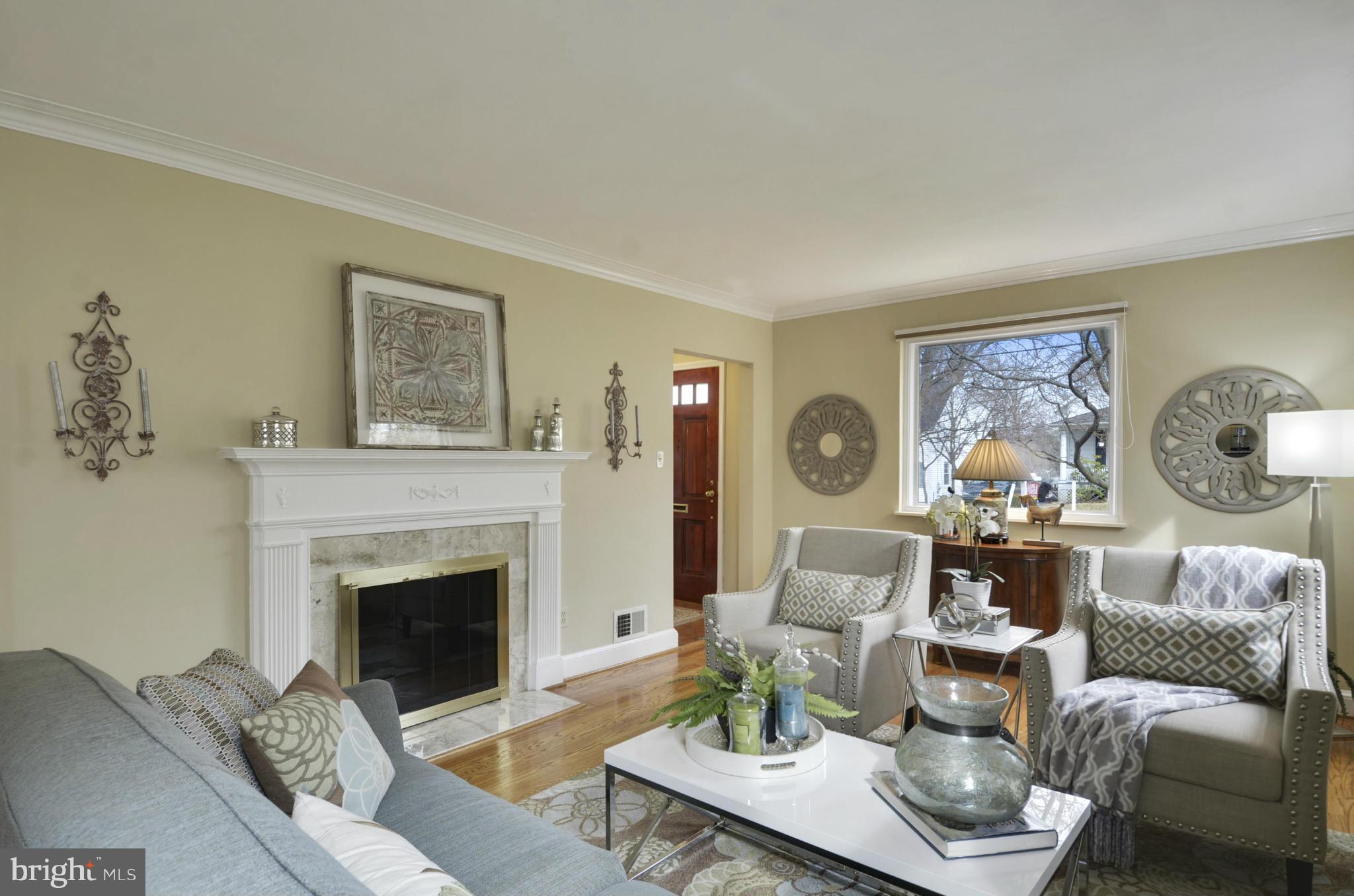 9810 Rosensteel Avenue Silver Spring, MD 20910 - Photo 2 of 30 LIVING RM WITH HARDWOOD FLOORS AND FIREPLACE