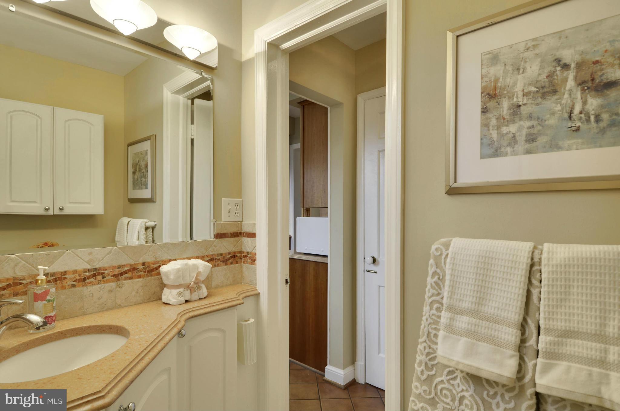 9810 Rosensteel Avenue Silver Spring, MD 20910 - Photo 6 of 30 MAIN LEVEL POWDER ROOM JUST OFF BEDROOM