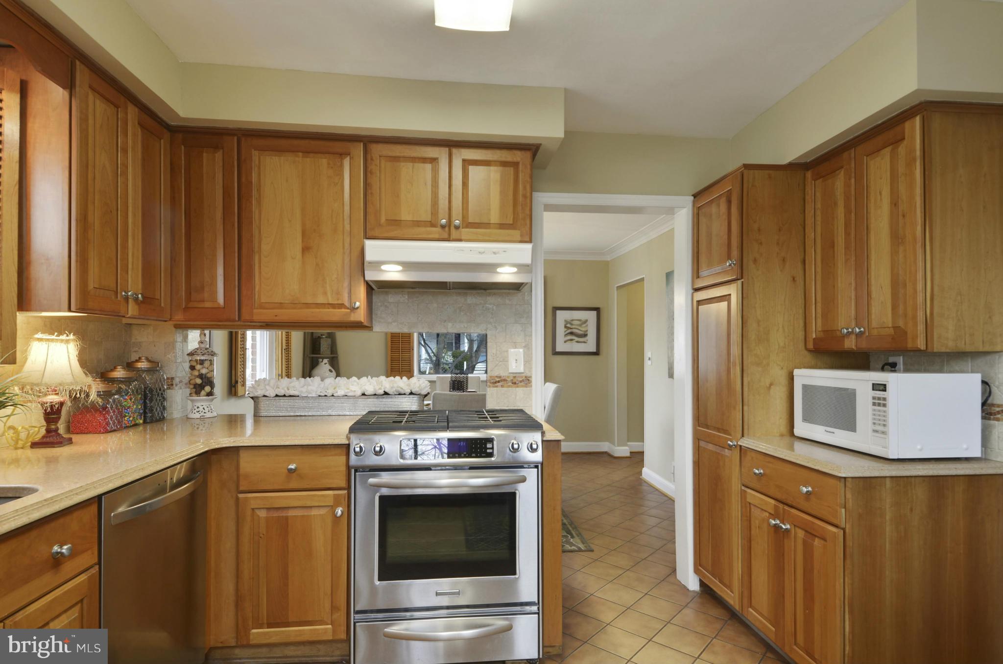 9810 Rosensteel Avenue Silver Spring, MD 20910 - Photo 7 of 30 UPDATED KITCHEN WITH STAINLESS AND QUARTZ