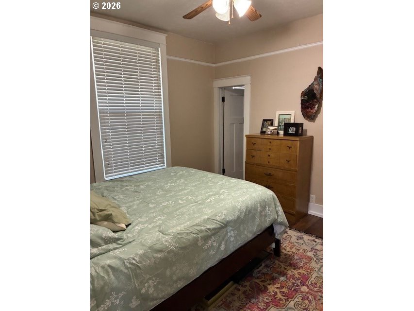 518 Northwest 4th Street Pendleton, OR 97801 - Photo 16 of 39 a bedroom with a bed and a chandelier
