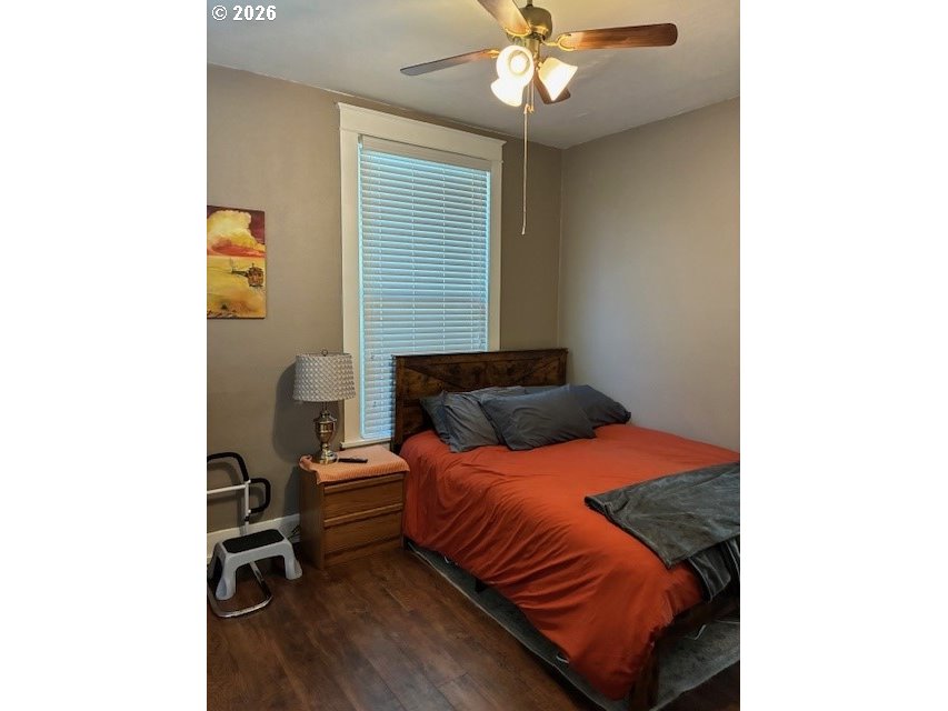 518 Northwest 4th Street Pendleton, OR 97801 - Photo 18 of 39 a bedroom with a bed and a chandelier
