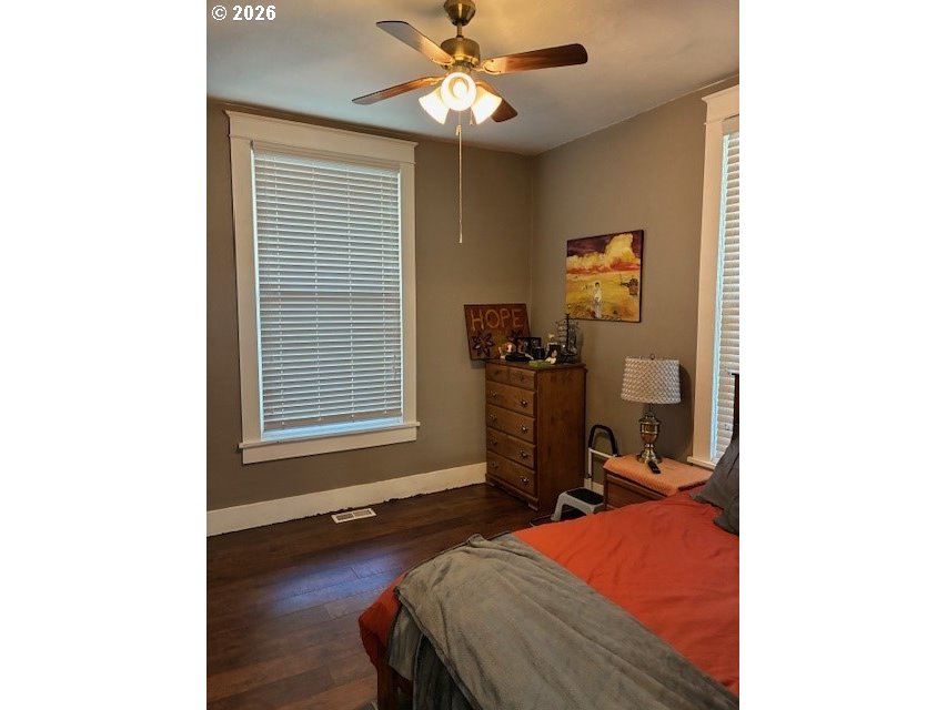 518 Northwest 4th Street Pendleton, OR 97801 - Photo 19 of 39 a bedroom with a bed and a chandelier