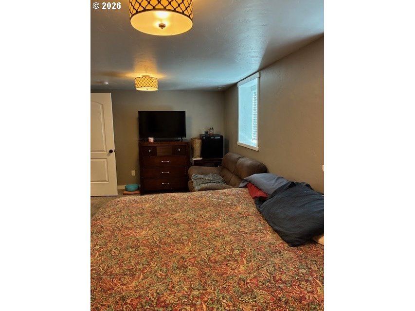 518 Northwest 4th Street Pendleton, OR 97801 - Photo 23 of 39 a living room with furniture and a flat screen tv