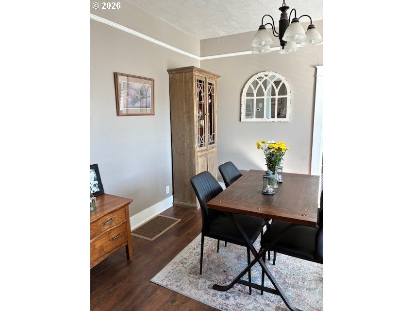 518 Northwest 4th Street Pendleton, OR 97801 - Photo 6 of 39 a view of a workspace room with wooden floor dining table