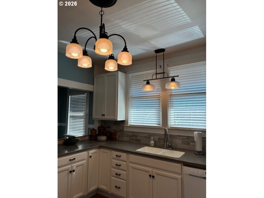 518 Northwest 4th Street Pendleton, OR 97801 - Photo 10 of 39 a kitchen with a sink cabinets and chandelier