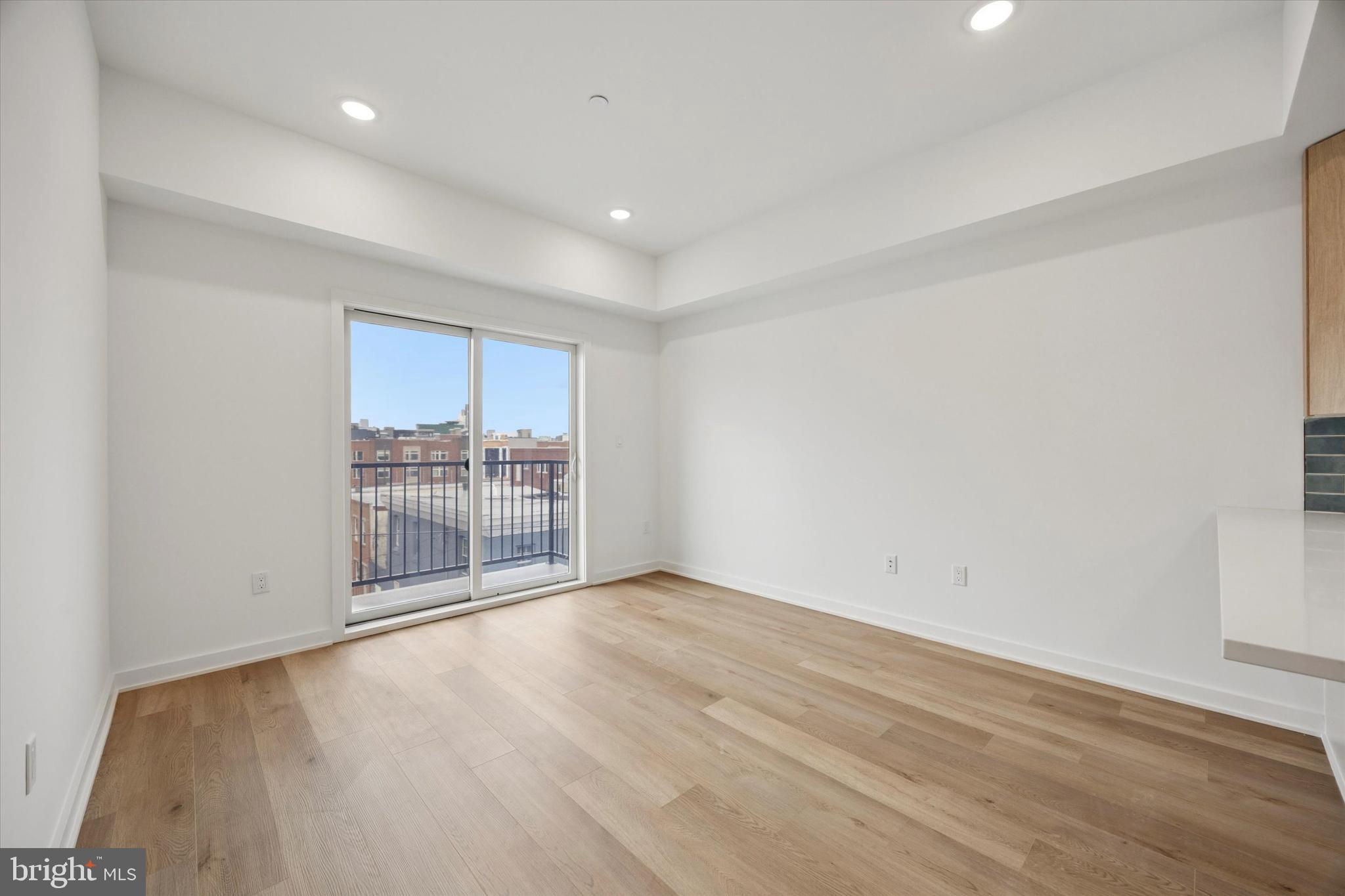 2020 Frankford Avenue, Unit 402 Philadelphia, PA 19125 - Photo 5 of 14 a view of a room with wooden floor and a window