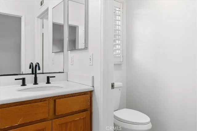 a view of a room with shelf on the wall