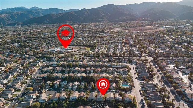 a view of a area with red and white car parked