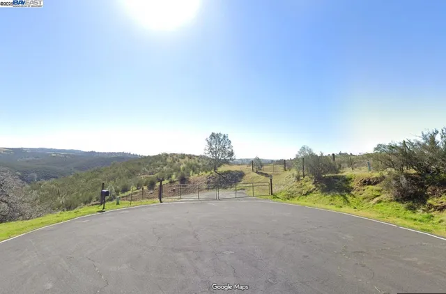 a view of a road with a mountain in the background