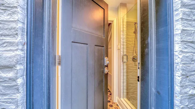a view of a bathroom with a glass door and shower