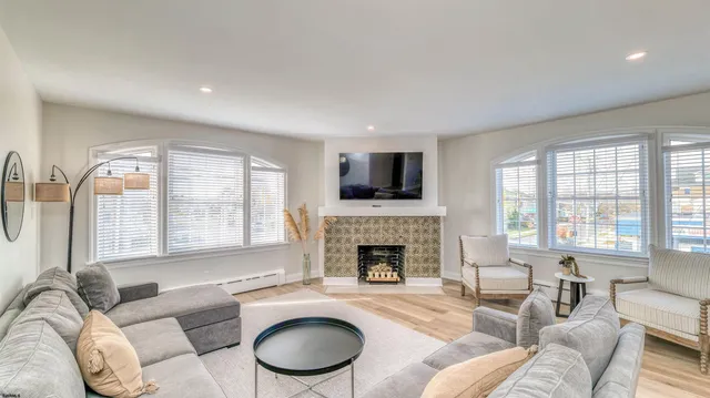 a living room with furniture and a fireplace