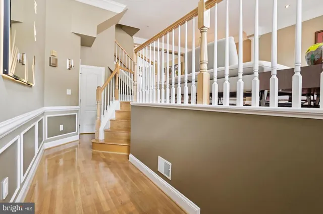a view of a balcony with wooden floor