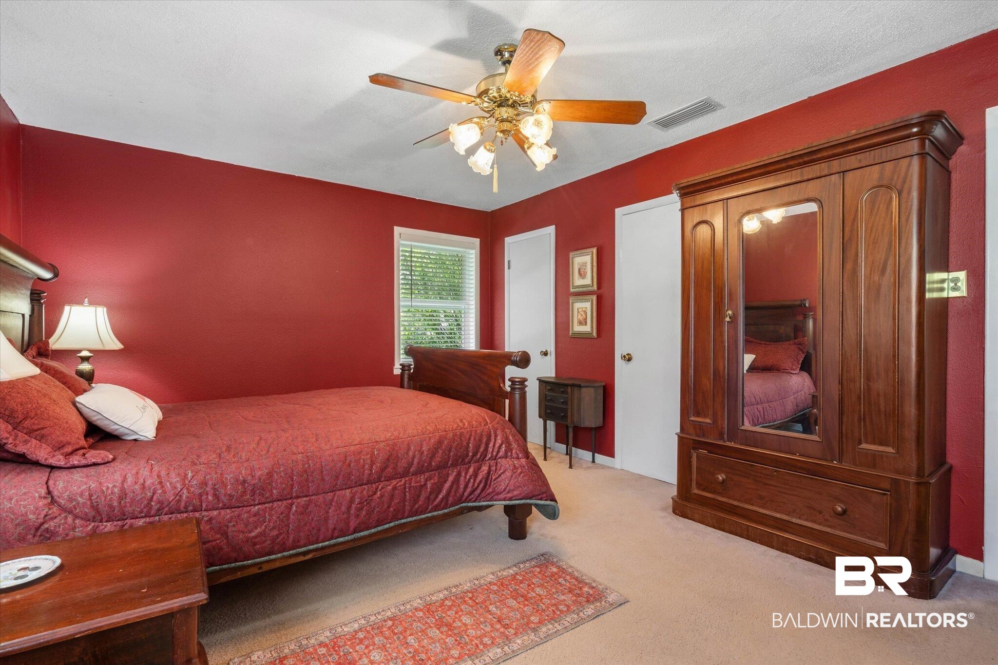 706 Sutherland Drive Chickasaw, AL 36611 - Photo 14 of 33 Bedroom featuring ceiling fan, visible vents, and light colored carpet