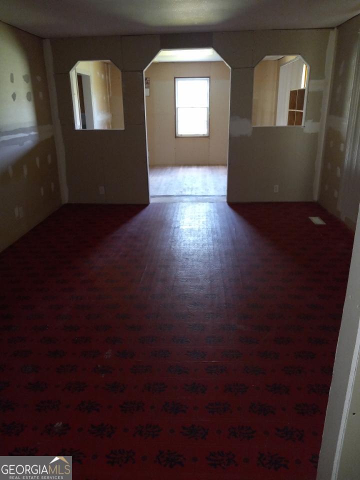 139 Moore Street Willacoochee, GA 31650 - Photo 19 of 33 a view of empty room with windows