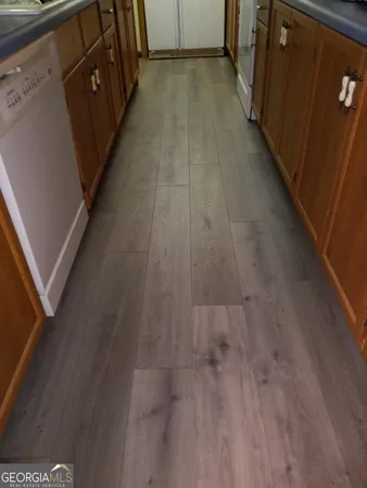 a view of a livingroom with wooden floor