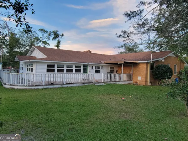 a view of a house with a garden