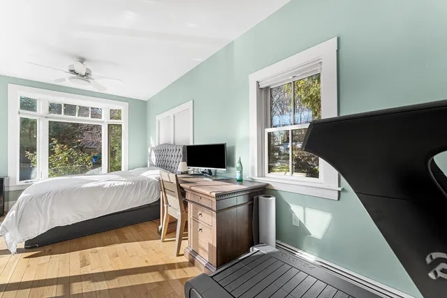 a bed room with a bed and a window