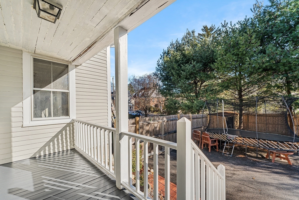 29 Cottage Street Wellesley, MA 02482 - Photo 29 of 42 a view of a house with backyard and trees