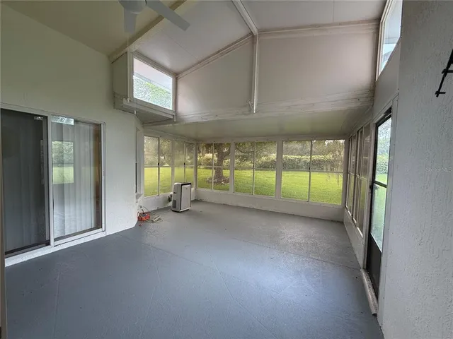 a view of a room with window and stairs