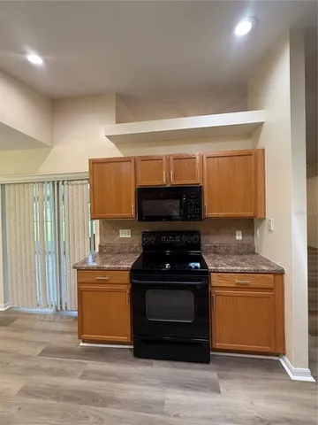 a kitchen with a stove and a cabinet