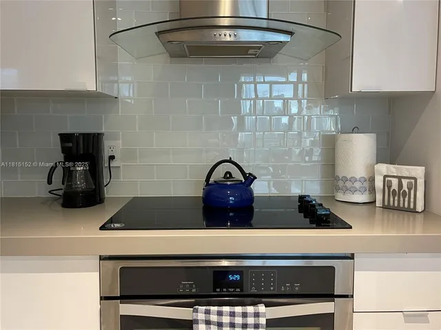 a vase of flowers sitting on a shelf