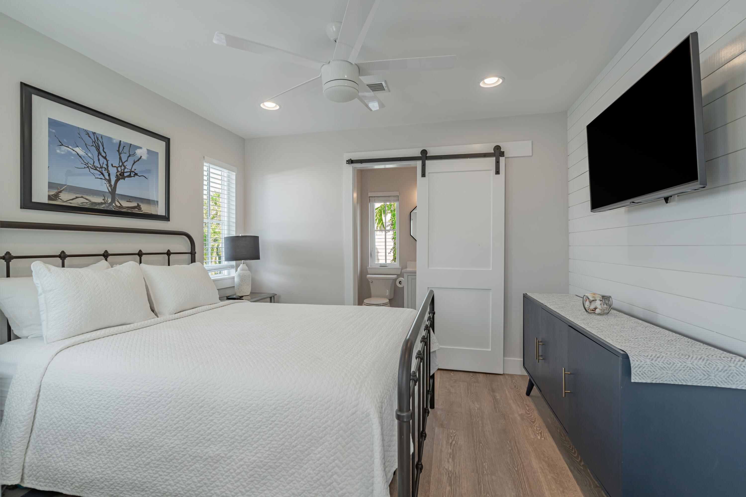 41 Abbie Road Santa Rosa Beach, FL 32459 - Photo 20 of 38 a bedroom with a bed and a flat screen tv