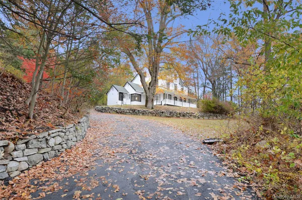 a view of large yard with large trees