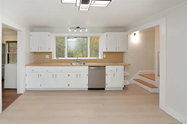 a view of cabinets with wooden floor