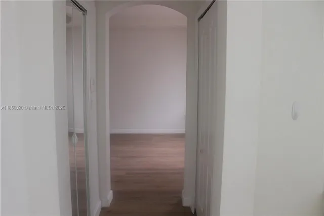 a bathroom with a shower sink and mirror