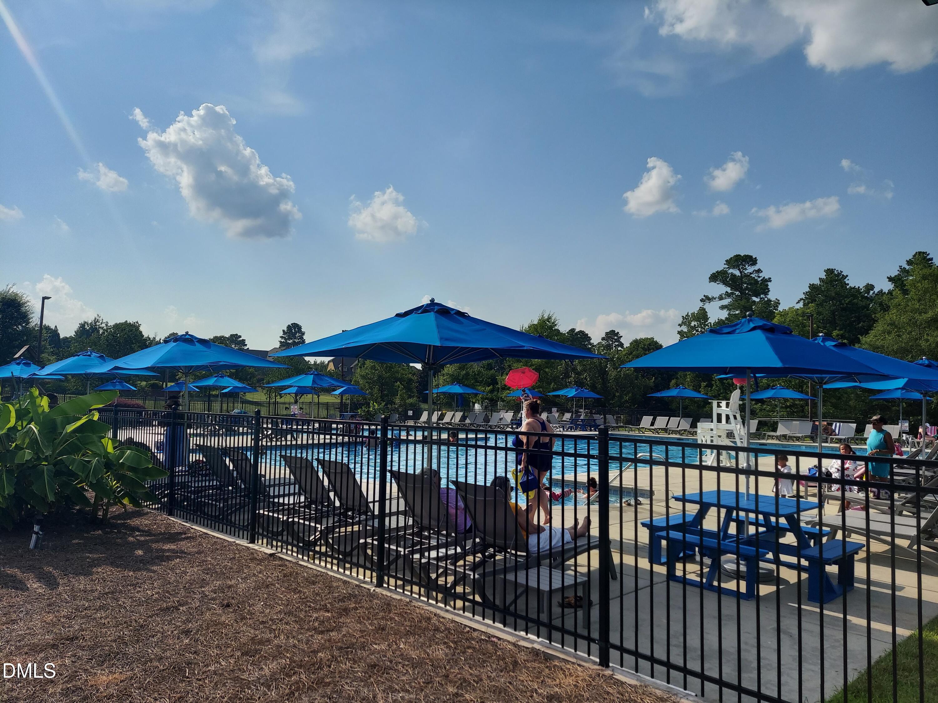408 Timpson Avenue Durham, NC 27703 - Photo 12 of 14 a view of a patio with a table and chairs under an umbrella