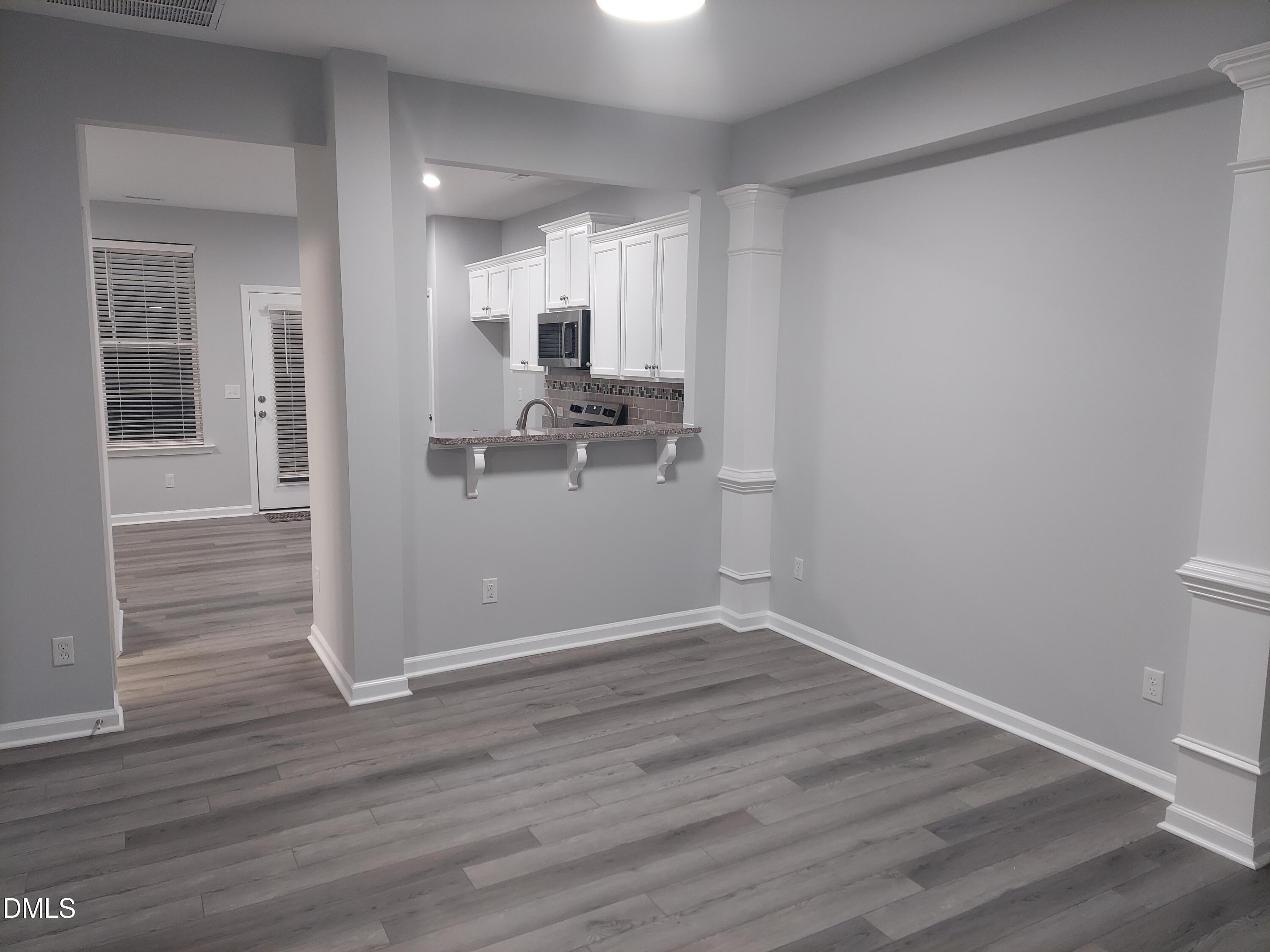 408 Timpson Avenue Durham, NC 27703 - Photo 3 of 14 a view of a kitchen with wooden floor and electronic appliances