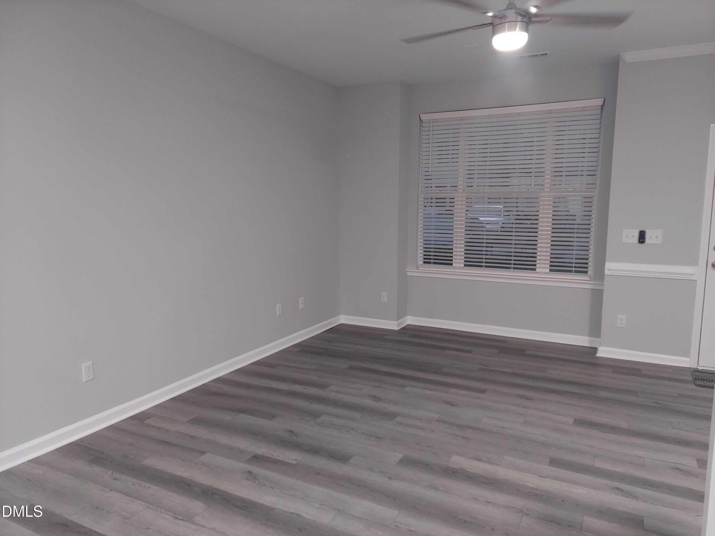 408 Timpson Avenue Durham, NC 27703 - Photo 4 of 14 wooden floor in an empty room with a window